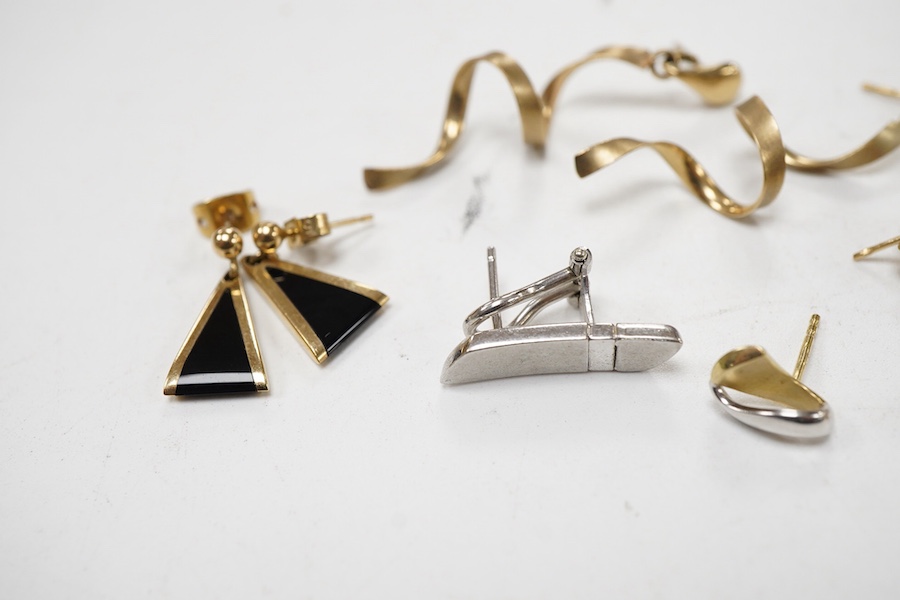 Three modern pairs of 9ct gold earrings, including spiral, triangular and moonstone set, together with five odd earrings.